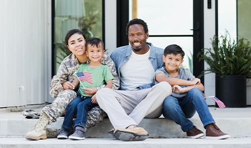 military family sitting on front porch