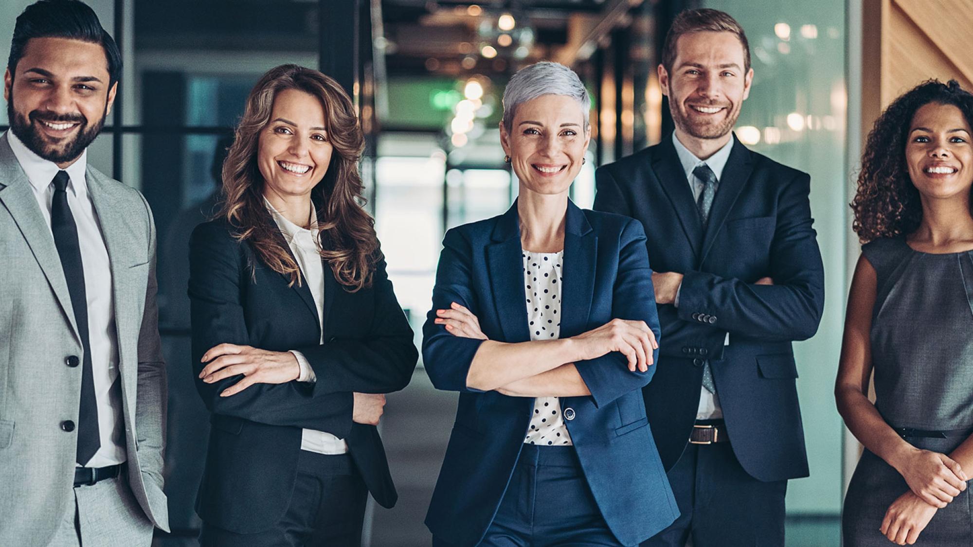 Business men and women standing together