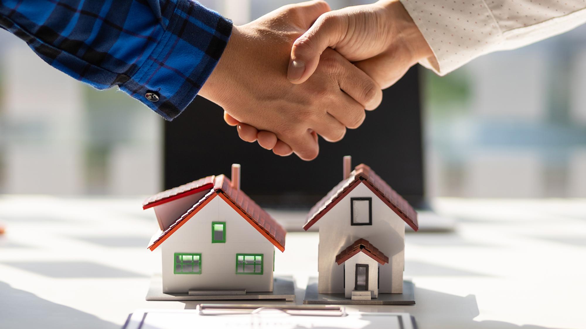 Mini houses over construction plans