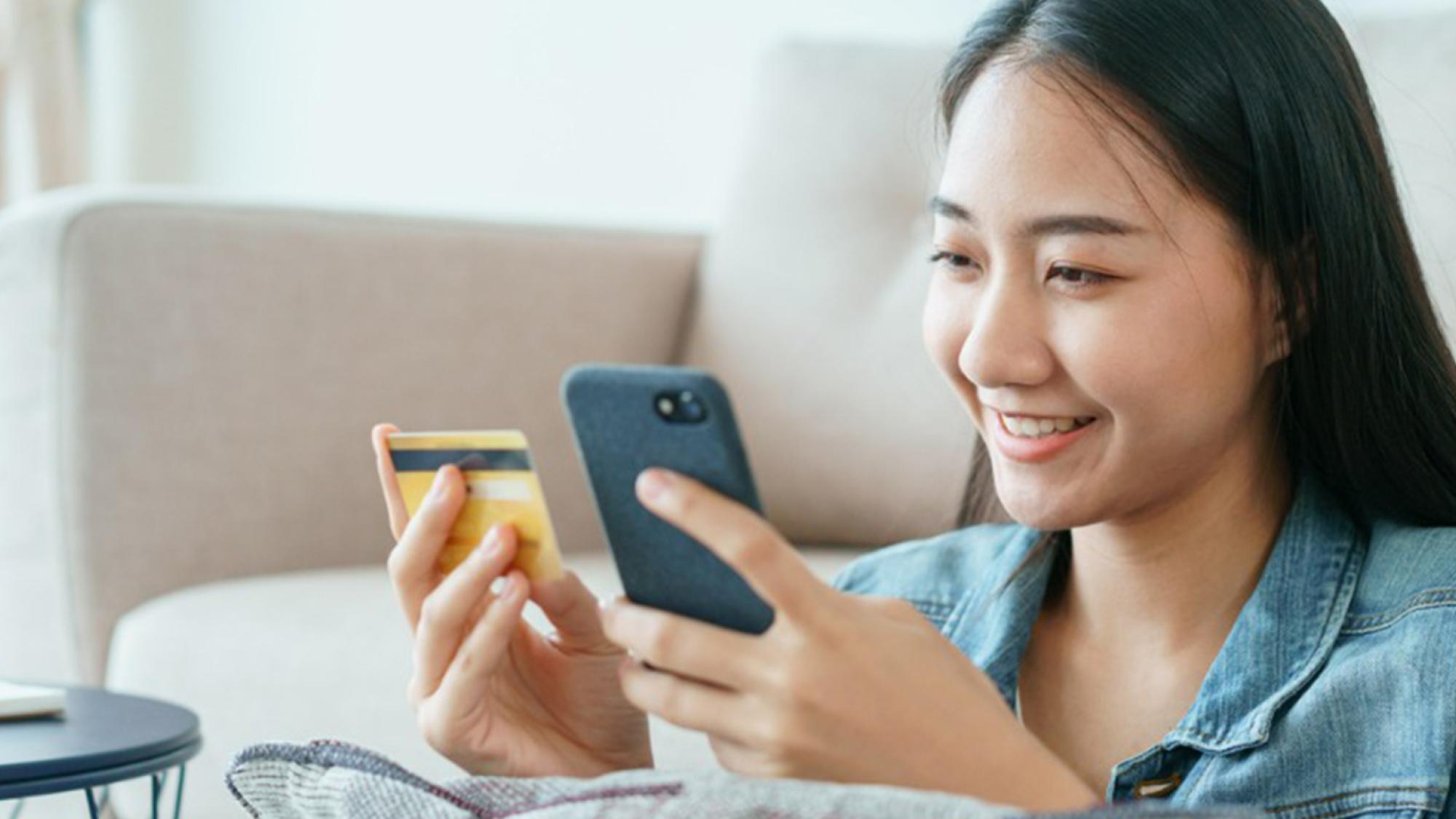 Young girl with debit card