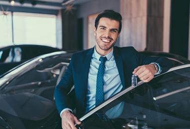 man standing by car, car buying