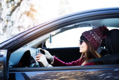 person driving a card that is winter ready