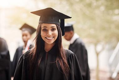 woman graduating in cap and gown