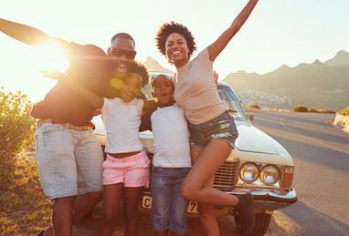 happy family in front of car, refinance auto loan