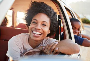 mom and child in car, early car loan payoff