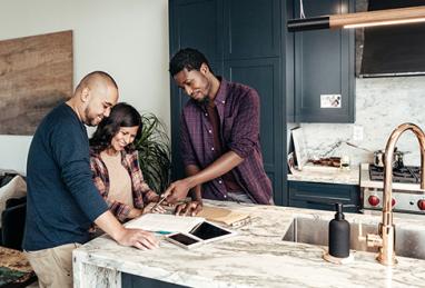 couple with contractor in kitchen, home equity