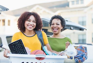 mom an daughter with dorm room items