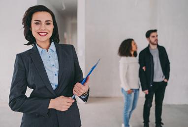 young couple with Realtor