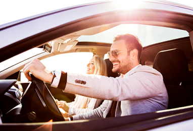 couple driving a car, auto loans