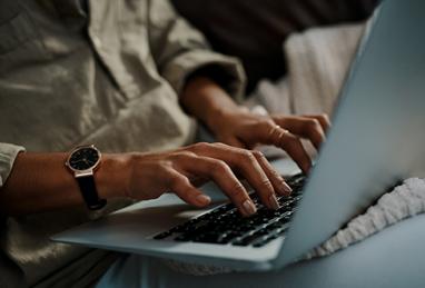 close-up of hands typing on a laptop keyboard, digital banking, online security, cybersecurity