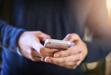 closeup of hands holding a smartphone