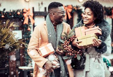 young adult couple shopping during the holidays, shopping for holiday gifts, holiday décor, holiday shopping 