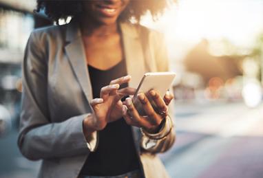 Close up shot of a businesswoman using a cellphone in the city