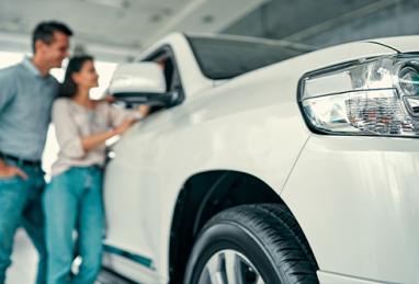 Man and woman looking at a new car, car buying, car shopping, buying a car