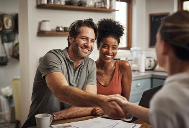 shot of middle aged man shaking hands with a financial advisor