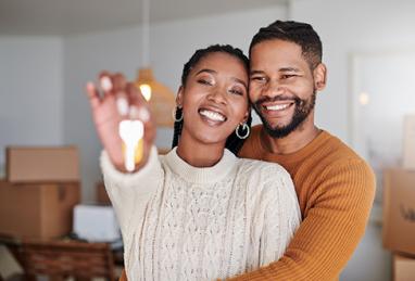 Shot of young black couple showing off the keys to their new home 
