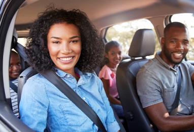 happy black family smiling in car, family in car, driving car 
