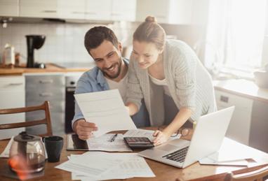 photo of young couple calculating home finances