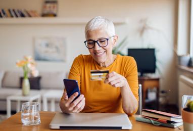 Mature woman banking from her home office