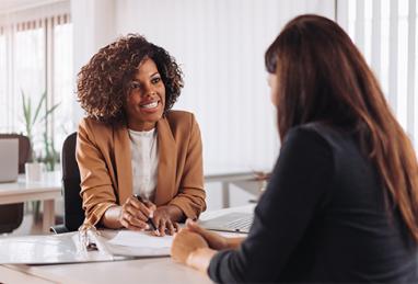 female financial consultant manager talking with a client at a bank 