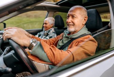 senior couple on a road trip in a car together