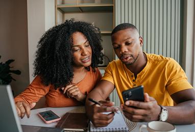 Couple deciding how to use their tax refund to kick-start their savings