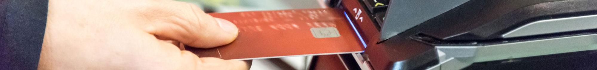 Person inserting card into atm